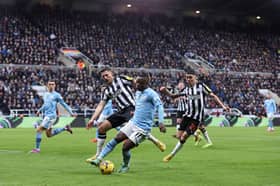 Jeremy Doku in action against Newcastle United. The Belgian is a doubt for City's Champions League clash against FC Copenhagen ahead of games against Liverpool and their FA Cup Quarter Final versus Newcastle United.