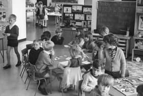 Children at Ashley Road School sit in groups in this retro view. Can you spot someone you know? 
