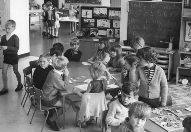 Children at Ashley Road School sit in groups in this retro view. Can you spot someone you know? 