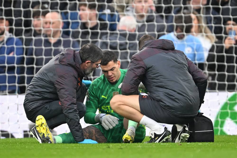 Ederson of Manchester City receives medical treatment after sustaining an injury and is later substituted off during the Premier League match between Liverpool FC and Manchester City at Anfield on March 10, 2024 in Liverpool, England. (Photo by Michael Regan/Getty Images)