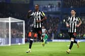 Alexander Isak of Newcastle United celebrates scoring his team's first goal with teammate Miguel Almiron during the Premier League match between Chelsea FC and Newcastle United at Stamford Bridge on March 11, 2024 in London, England. (Photo by Alex Pantling/Getty Images)