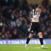 Sean Longstaff looks dejected during Newcastle United's 3-2 defeat against Chelsea. 