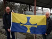 South Shields residents Graeme Keedy (L) and Terry Ford (R) with the County Durham flag at the restored "Tyne" lifeboat. 