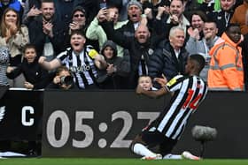 Newcastle United's Swedish striker #14 Alexander Isak celebrates  after scoring the opening goal from the penalty spot during the English Premier League football match between Newcastle United and West Ham United at St James' Park in Newcastle-upon-Tyne, north east England on March 30, 2024. (Photo by Paul ELLIS / AFP)