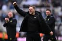 Newcastle United's English head coach Eddie Howe (C) celebrates on the pitch after the English Premier League football match between Newcastle United and West Ham United at St James' Park in Newcastle-upon-Tyne, north east England on March 30, 2024. Newcastle won the game 4-3. (Photo by Paul ELLIS / AFP)