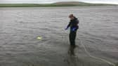 The team search a lake for Excalibur.