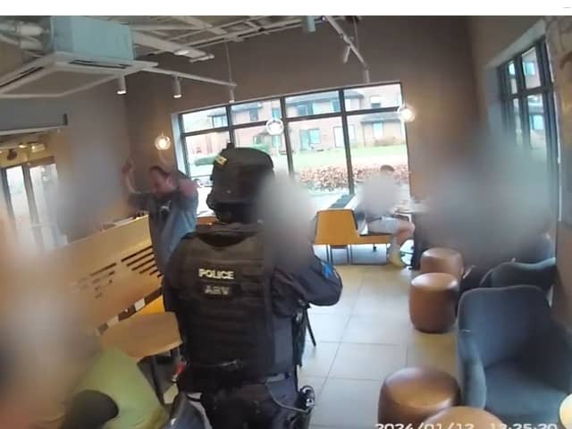 armed police arrest man in Starbucks