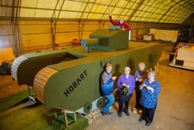 (L to R) Lynn Hart, Hazel Barker, Carol Dunkley, Sandra Searle and Stuart Martin beside the knitted tank.