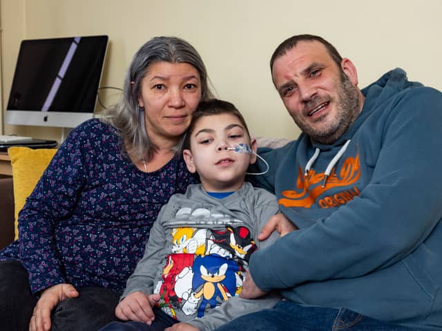 William with his mum Mihaela and dad Simon. William Howard, nine, was told by doctors his initial symptom, a twitch in his right leg, could be down to stress from playing Minecraft but in fact he has a rare and deadly disease.