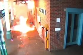 Video grab of the moment an e-bike exploded, causing a "ferocious" fire - as its owner stood waiting for a train. 