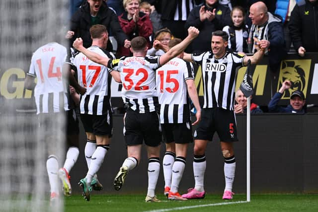 Fabian Schar of Newcastle United celebrates scoring his team's fourth goal during the Premier League match between Newcastle United and Tottenham Hotspur at St. James Park on April 13, 2024 in Newcastle upon Tyne, England.