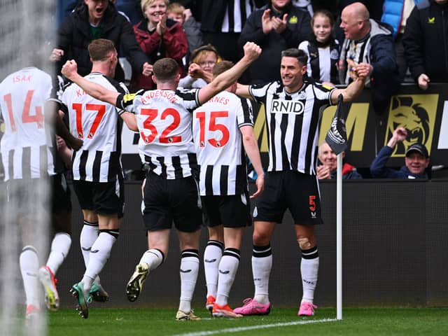 Fabian Schar of Newcastle United celebrates scoring his team's fourth goal during the Premier League match between Newcastle United and Tottenham Hotspur at St. James Park on April 13, 2024 in Newcastle upon Tyne, England.