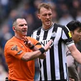 Newcastle United player Dan Burn reacts as referee Tim Robinson makes a point during the Premier League match between Newcastle United and Tottenham Hotspur at St. James Park on April 13, 2024 in Newcastle upon Tyne, England. (Photo by Stu Forster/Getty Images) (Photo by Stu Forster/Getty Images)