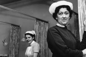 Miss N Collingwood, assistant matron at the Ingham Infirmary, switches on the background music which was installed for a trial period in January 1965. 