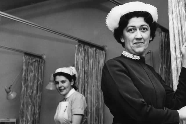 Miss N Collingwood, assistant matron at the Ingham Infirmary, switches on the background music which was installed for a trial period in January 1965. 