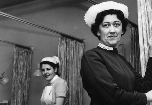 Miss N Collingwood, assistant matron at the Ingham Infirmary, switches on the background music which was installed for a trial period in January 1965. 