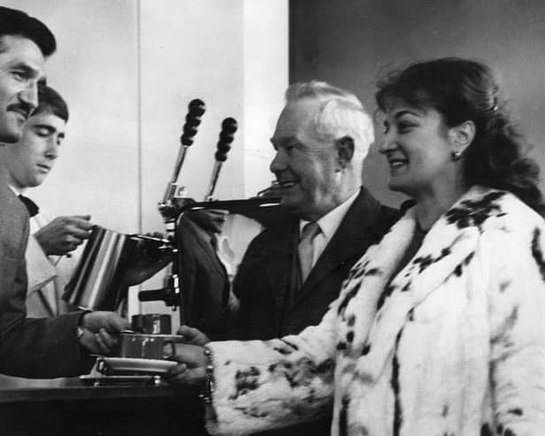 A November 1966 photo showing the new bar at Wouldhave House with Lennard May - South Shields entertainments official - and Mrs Franchi being served coffee by Michael Franchi