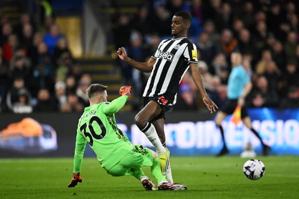 Alexander Isak of Newcastle United is challenged by Dean Henderson of Crystal Palace during the Premier League match between Crystal Palace and Newcastle United at Selhurst Park on April 24, 2024 in London, England. (Photo by Justin Setterfield/Getty Images)