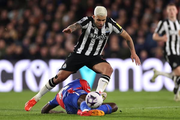Bruno Guimaraes of Newcastle United is challenged by Jean-Philippe Mateta of Crystal Palace during the Premier League match between Crystal Palace and Newcastle United at Selhurst Park on April 24, 2024 in London, England. (Photo by Ryan Pierse/Getty Images)