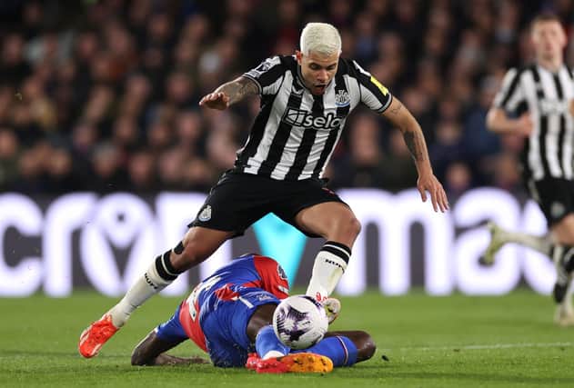 Bruno Guimaraes of Newcastle United is challenged by Jean-Philippe Mateta of Crystal Palace during the Premier League match between Crystal Palace and Newcastle United at Selhurst Park on April 24, 2024 in London, England. (Photo by Ryan Pierse/Getty Images)