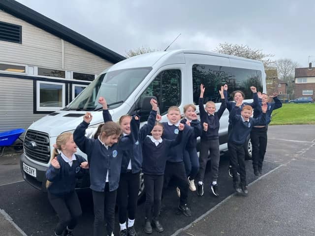 The pupils love their love school bus