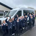 The pupils love their love school bus