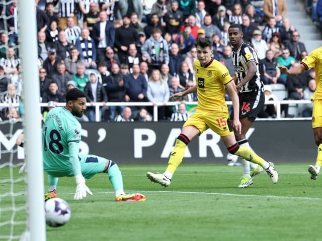 Alexander Isak of Newcastle United looks on as he scores his team's first goal past Wes Foderingham of Sheffield United during the Premier League match between Newcastle United and Sheffield United at St. James Park on April 27, 2024 in Newcastle upon Tyne, England. (Photo by Ian MacNicol/Getty Images)