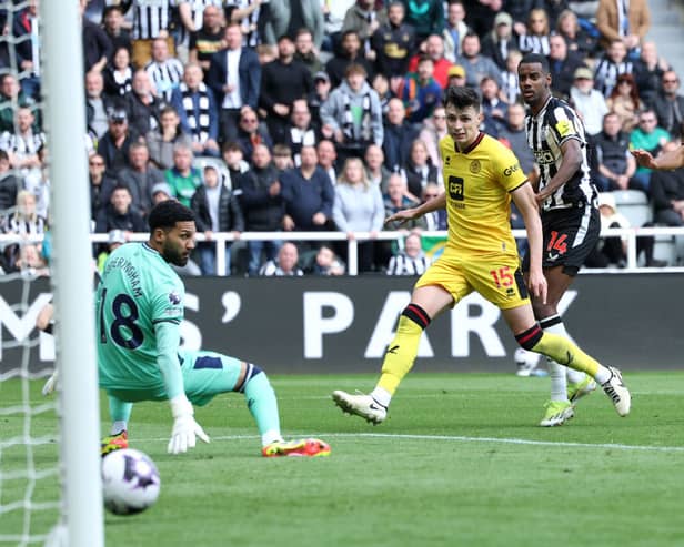 Alexander Isak of Newcastle United looks on as he scores his team's first goal past Wes Foderingham of Sheffield United during the Premier League match between Newcastle United and Sheffield United at St. James Park on April 27, 2024 in Newcastle upon Tyne, England. (Photo by Ian MacNicol/Getty Images)