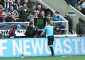 Tony Harrington checks the Video Assistant Referee screen during the Premier League match between Newcastle United and Sheffield United at St. James Park