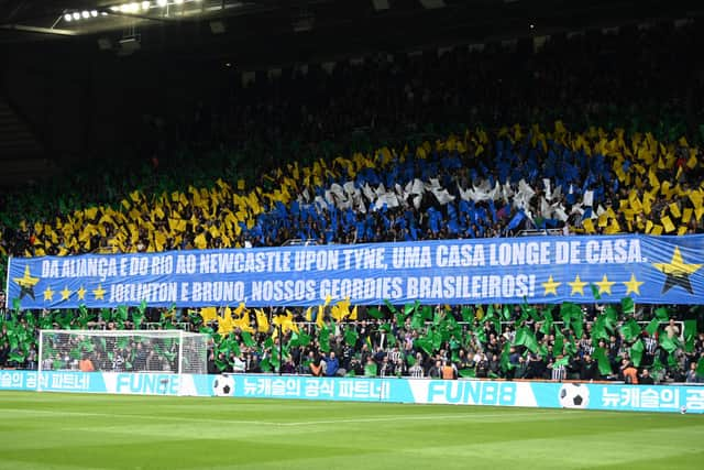  A banner and tefoil display to honour the Newcastle Brazil players, Joelinton and Bruno Guimaraes translated to "From Alianca and Rio to Newcastle upon Tyne, a home away from home, Joelinton and Bruno, our Brazilian Geordies"  is seen in the Gallowgate end prior to the Premier League match between Newcastle United and Sheffield United at St. James Park on April 27, 2024 in Newcastle upon Tyne, England. (Photo by Stu Forster/Getty Images)