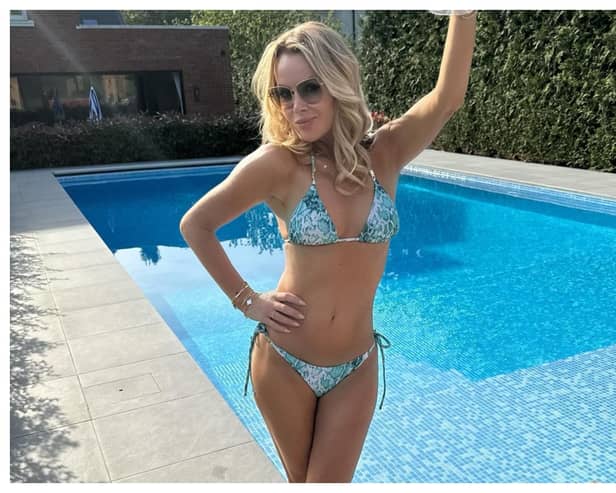 Amanda Holden is making the most of the spring weekend sunshine by enjoying time spent by her pool at her luxury mansion in Surrey. 