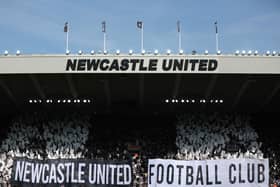 Fans of Newcastle United show their support with banners and flags prior to the Premier League match between Newcastle United and Brighton & Hove Albion at St. James Park on May 11, 2024 in Newcastle upon Tyne, England. (Photo by George Wood/Getty Images)