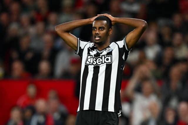 Alexander Isak reacts to a missed opportunity for Newcastle United at Old Trafford. 