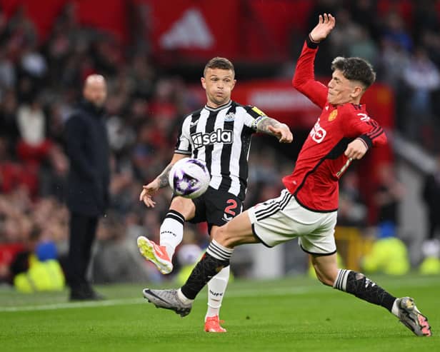 Kieran Trippier of Newcastle United passes the ball from Alejandro Garnacho of Manchester United during the Premier League match between Manchester United and Newcastle United at Old Trafford on May 15, 2024 in Manchester, England. (Photo by Stu Forster/Getty Images)