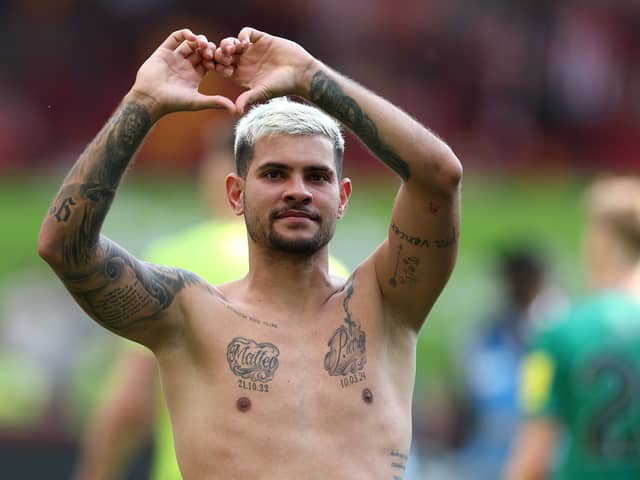 Bruno Guimaraes of Newcastle United signals to the supporters after the Premier League match between Brentford FC and Newcastle United at Brentford Community Stadium on May 19, 2024 in Brentford, England. (Photo by Richard Heathcote/Getty Images)
