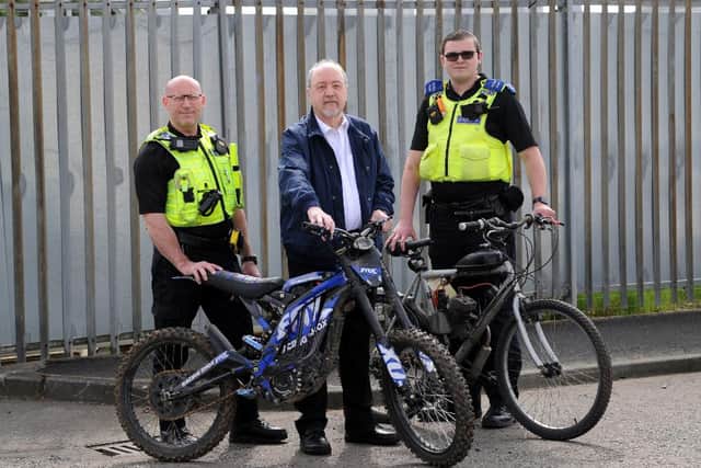 L-R PC Darren Lough, Cllr Jim Foreman, PCSO Callum Thompson with bikes that have been seized