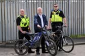 L-R PC Darren Lough, Cllr Jim Foreman, PCSO Callum Thompson with bikes that have been seized