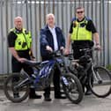 L-R PC Darren Lough, Cllr Jim Foreman, PCSO Callum Thompson with bikes that have been seized