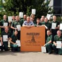 Robson Green, centre, joined Barbour employees who were receiving NVQ level 2 awards in 2013. Recognise anyone?