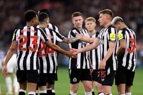 Newcastle United players celebrate after Alexander Isak's goals against Tottenham Hotspur. (Photo by MARTIN KEEP/AFP via Getty Images)