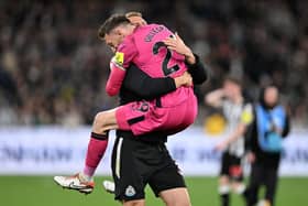 Newcastle United goalkeeper Mark Gillespie FC and Dan Burn of Newcastle United FC celebrate winning the exhibition match between Tottenham Hotspur FC and Newcastle United FC at Melbourne Cricket Ground on May 22, 2024 in Melbourne, Australia. (Photo by Daniel Pockett/Getty Images)