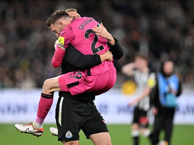 Newcastle United goalkeeper Mark Gillespie FC and Dan Burn of Newcastle United FC celebrate winning the exhibition match between Tottenham Hotspur FC and Newcastle United FC at Melbourne Cricket Ground on May 22, 2024 in Melbourne, Australia. (Photo by Daniel Pockett/Getty Images)