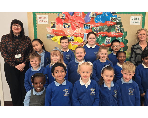 SS Peter and Paul Catholic Primary School headteacher, Maria Butt (left) with pupils from the school following another successful Ofsted rating.