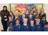 SS Peter and Paul Catholic Primary School headteacher, Maria Butt (left) with pupils from the school following another successful Ofsted rating.