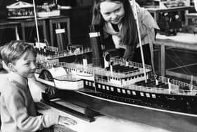 John and Mary Benvin looking at a model of the steam packet La Marguerite. It was on show in a model engineering exhibition held in Perth Green School.