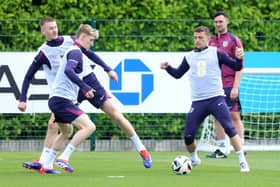 Adam Wharton, Anthony Gordon and Kieran Trippier of England battle for possession during a training session at Tottenham Hotspur Training Centre on June 06, 2024 in Enfield, England. (Photo by Richard Pelham/Getty Images)