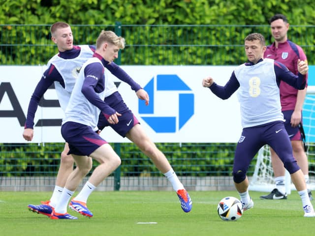 Adam Wharton, Anthony Gordon and Kieran Trippier of England battle for possession during a training session at Tottenham Hotspur Training Centre on June 06, 2024 in Enfield, England. (Photo by Richard Pelham/Getty Images)