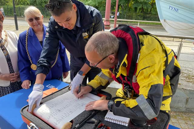 David Robinson, retired Deputy Coxswain of Tynemouth Lifeboat signing the 200th anniversary scroll. Photo: National World.
