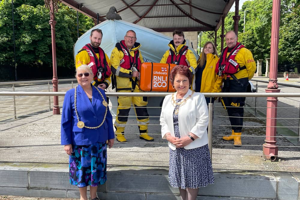 The Mayor and Mayoress of South Tyneside in front of the Tynemouth RNLI crew. The crew are holding the case which houses the scroll marking the 200th anniversary of the RNLI. Photo: National World.