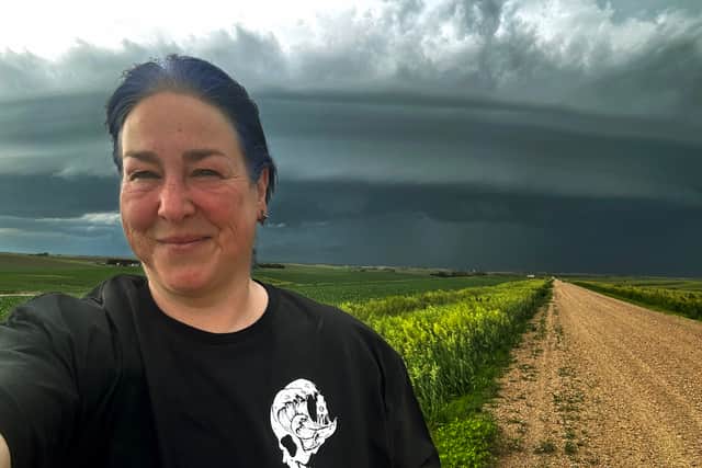 Abbi has kept home close to her as she wears Sanddancer Clothing while chasing storms.